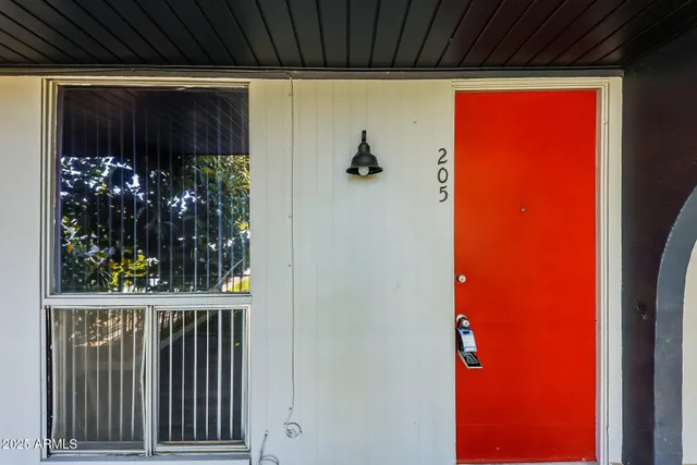 a picture of a bench in front of a door