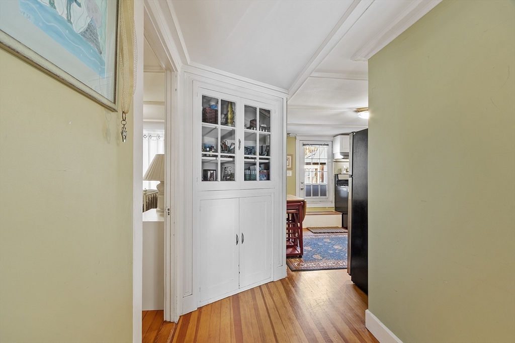 10 Oak Street, Unit 3 Gloucester, MA 01930 - Photo 13 of 24 a view of a hallway with wooden floor and windows