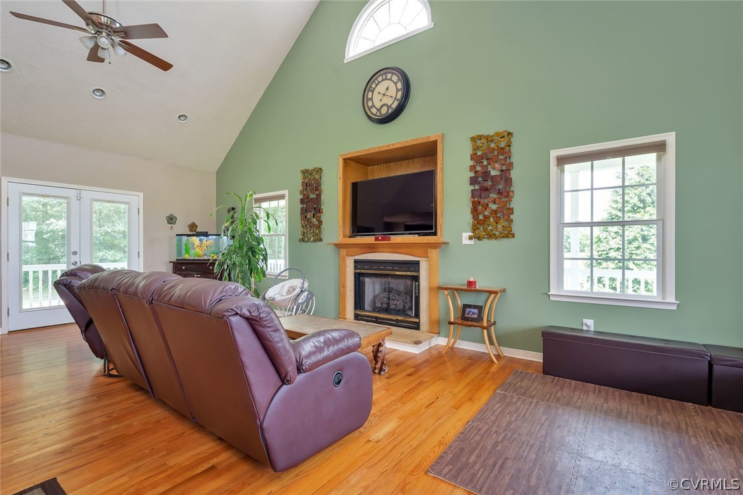 14498 Scotts Lane Carson, VA 23830 - Photo 11 of 44 a living room with furniture a fireplace and a flat screen tv