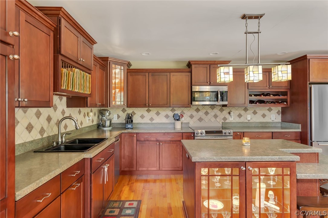 14498 Scotts Lane Carson, VA 23830 - Photo 14 of 44 a kitchen with stainless steel appliances granite countertop a sink stove and cabinets