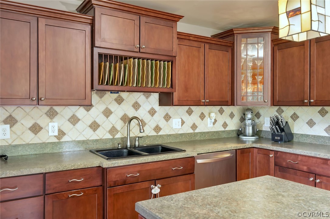 14498 Scotts Lane Carson, VA 23830 - Photo 15 of 44 a kitchen with granite countertop wooden cabinets and sink