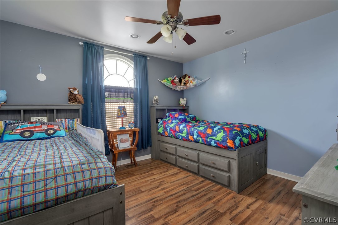 14498 Scotts Lane Carson, VA 23830 - Photo 19 of 44 a bedroom with bed and a chandelier