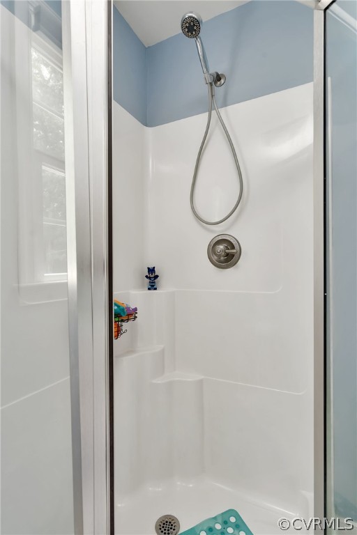14498 Scotts Lane Carson, VA 23830 - Photo 22 of 44 a bathroom with a glass shower door
