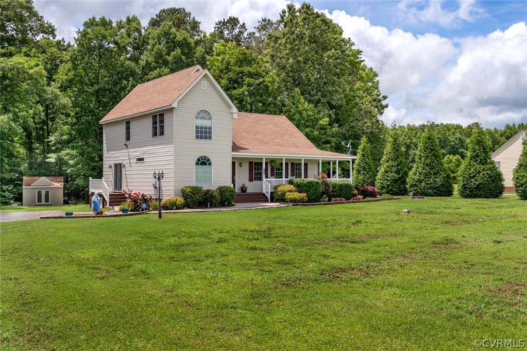 14498 Scotts Lane Carson, VA 23830 - Photo 3 of 44 a front view of a house with a yard and trees