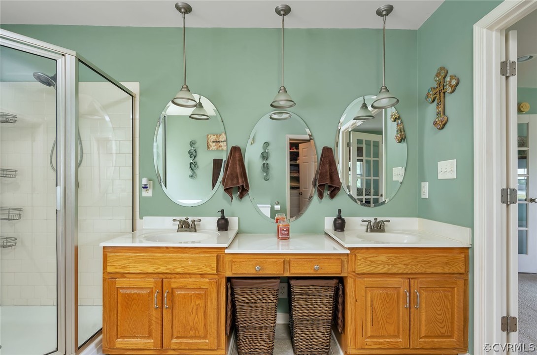 14498 Scotts Lane Carson, VA 23830 - Photo 31 of 44 a bathroom with a double vanity sink mirror and shower