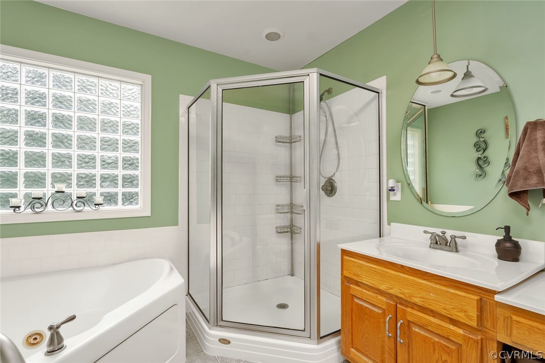 14498 Scotts Lane Carson, VA 23830 - Photo 32 of 44 a bathroom with a double vanity sink mirror and shower