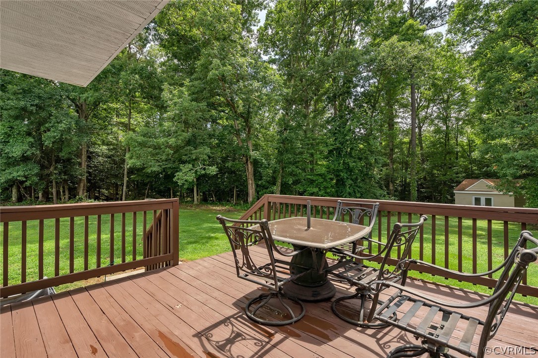 14498 Scotts Lane Carson, VA 23830 - Photo 37 of 44 a view of a chair and table on the wooden floor