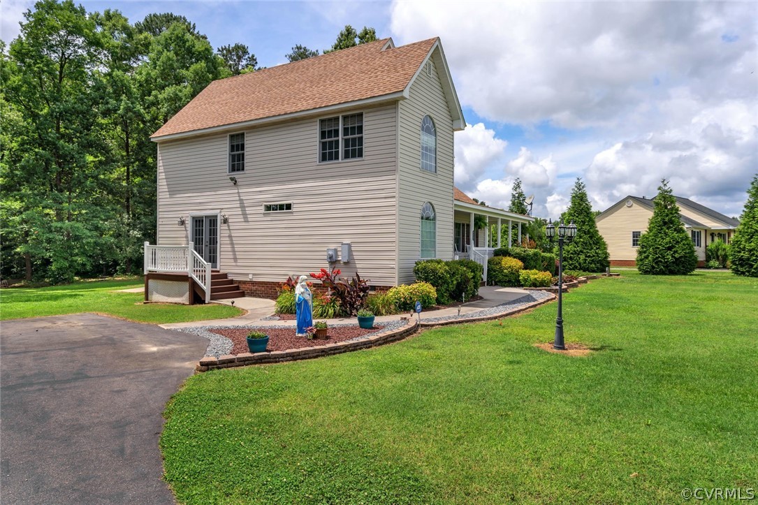 14498 Scotts Lane Carson, VA 23830 - Photo 4 of 44 a view of a house with backyard and sitting area