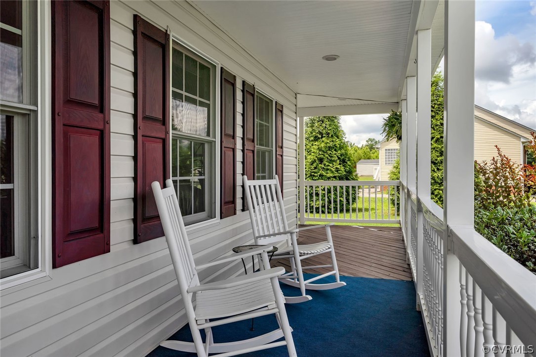 14498 Scotts Lane Carson, VA 23830 - Photo 5 of 44 a balcony with table and chairs