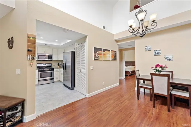 a kitchen with stainless steel appliances granite countertop a refrigerator and microwave