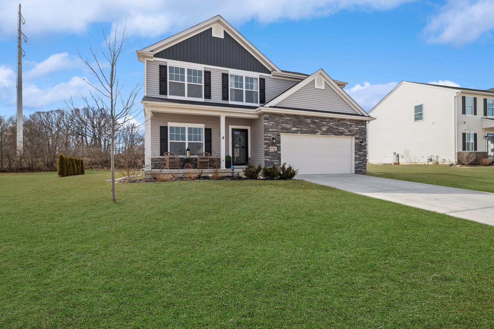 8766 Burr Rdg Circle Crown Point, IN 46307 - Photo 1 of 33 a front view of a house with a yard