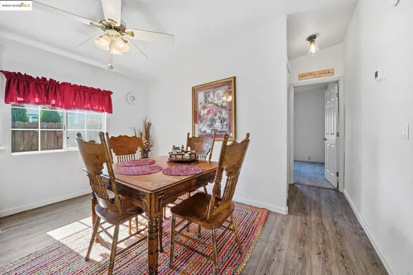 a view of a dining room with furniture window and wooden floor
