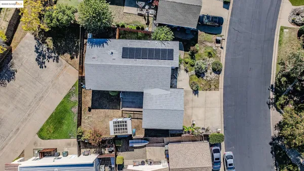 an aerial view of a house with outdoor space