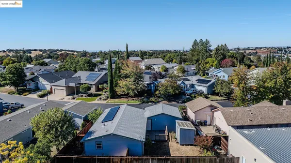 an aerial view of a house with a garden