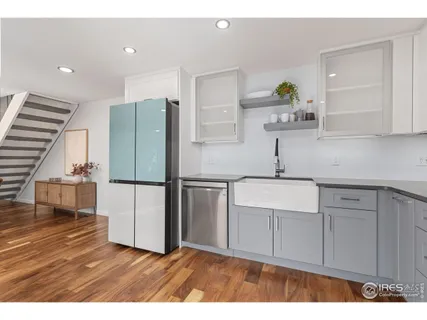 a kitchen with stainless steel appliances a refrigerator and a sink