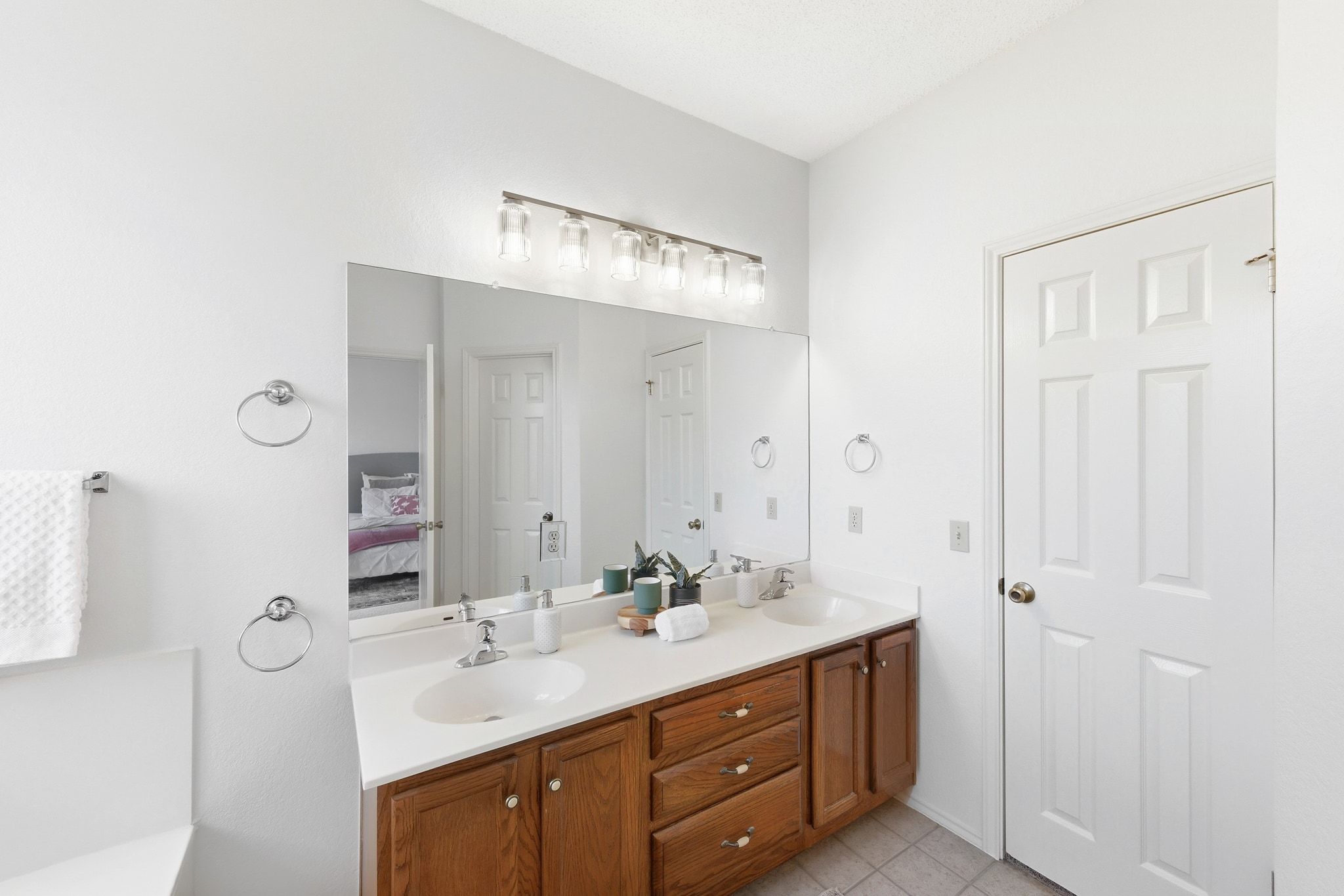 6412 Sailing Breeze Trail Austin, TX 78744 - Photo 12 of 18 a bathroom with a double vanity sink and a mirror