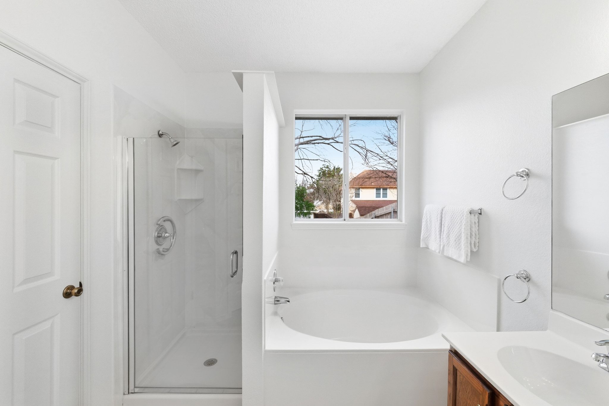 6412 Sailing Breeze Trail Austin, TX 78744 - Photo 13 of 18 a bathroom with a tub a sink and a shower
