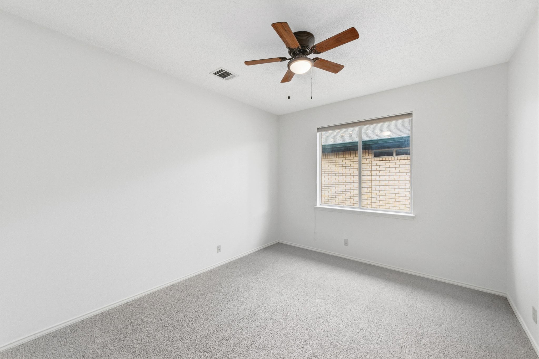 6412 Sailing Breeze Trail Austin, TX 78744 - Photo 15 of 18 an empty room with a window