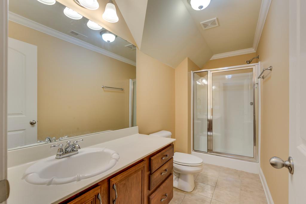 1206 White Rock Road Spring Hill, TN 37174 - Photo 18 of 30 a bathroom with a sink a toilet and shower