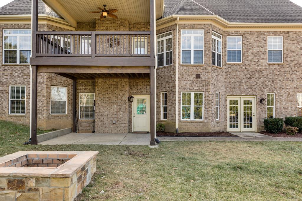 1206 White Rock Road Spring Hill, TN 37174 - Photo 28 of 30 a front view of a house with a garden