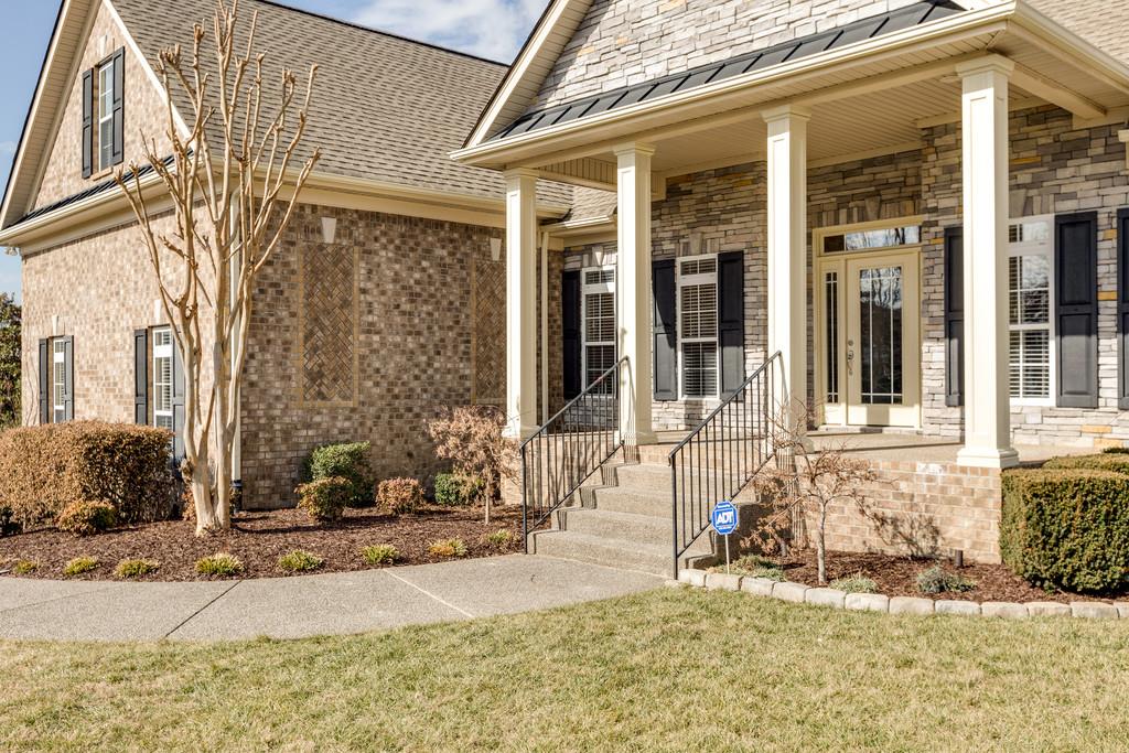1206 White Rock Road Spring Hill, TN 37174 - Photo 4 of 30 front view of a brick house with a outdoor space