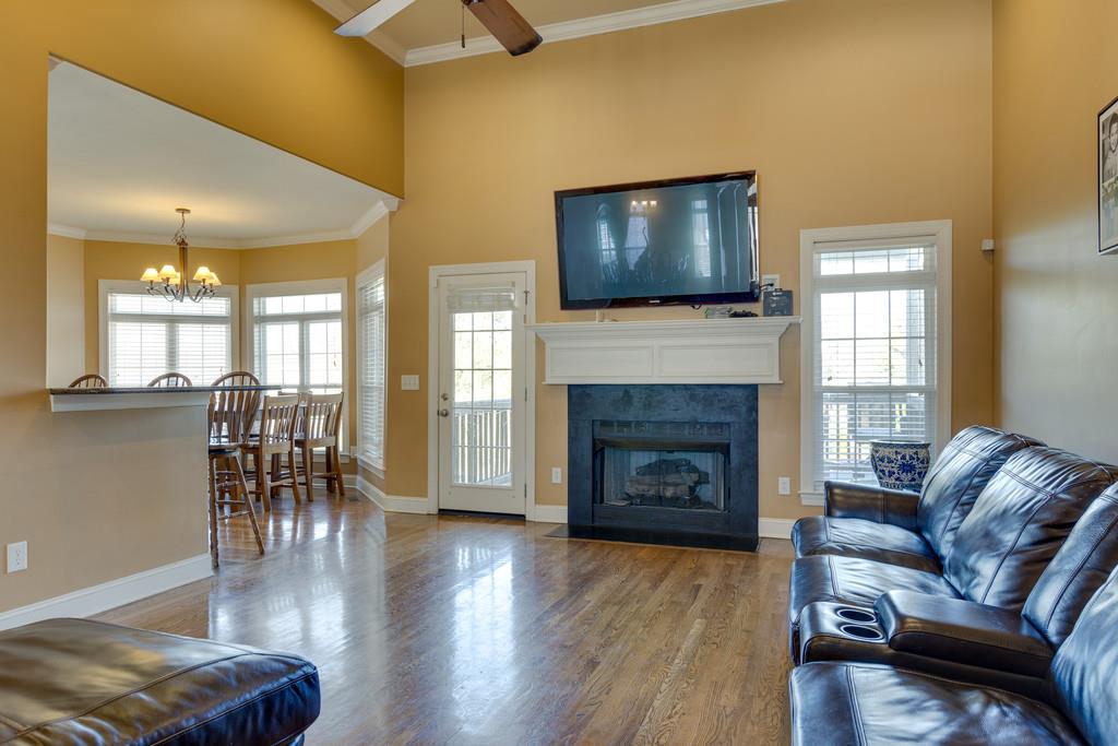 1206 White Rock Road Spring Hill, TN 37174 - Photo 7 of 30 a living room with furniture and a flat screen tv