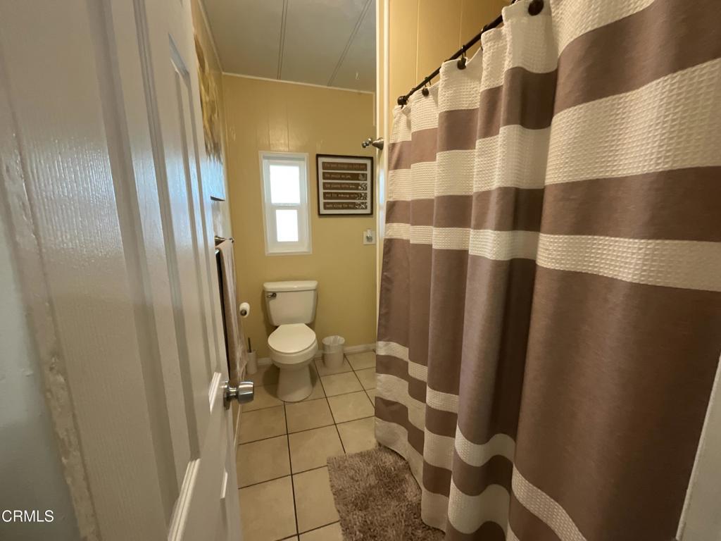 15433 West Telegraph Road, Unit 54 Santa Paula, CA 93060 - Photo 16 of 25 a bathroom with a toilet and a shower