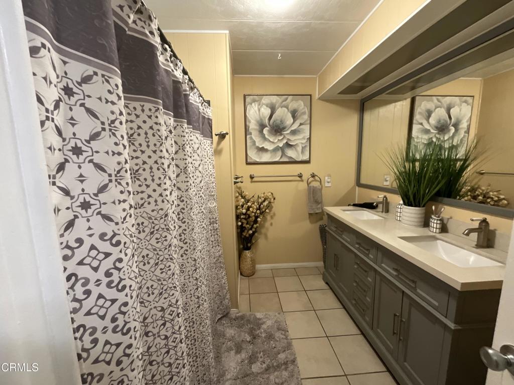 15433 West Telegraph Road, Unit 54 Santa Paula, CA 93060 - Photo 20 of 25 a bathroom with a sink toilet and shower