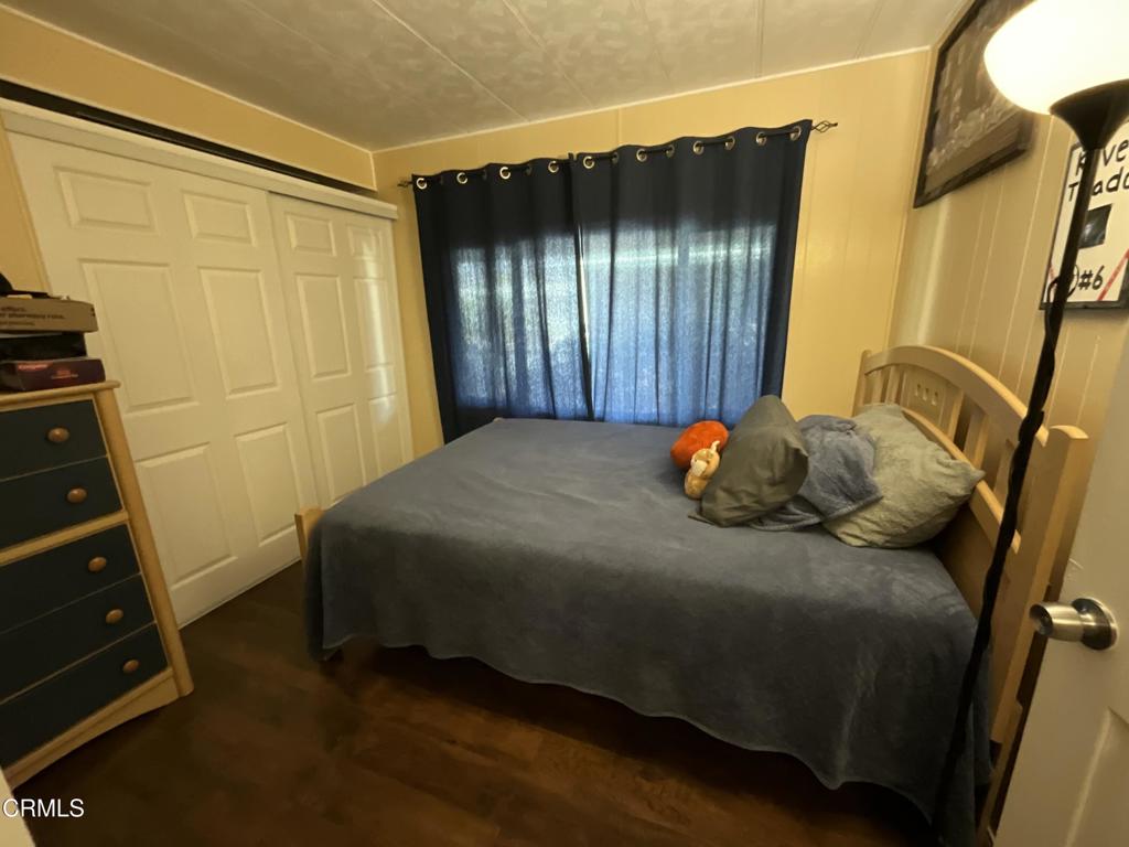 15433 West Telegraph Road, Unit 54 Santa Paula, CA 93060 - Photo 22 of 25 a bedroom with a bed and a dresser