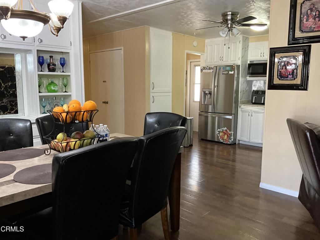 15433 West Telegraph Road, Unit 54 Santa Paula, CA 93060 - Photo 6 of 25 a living room with furniture and a chandelier