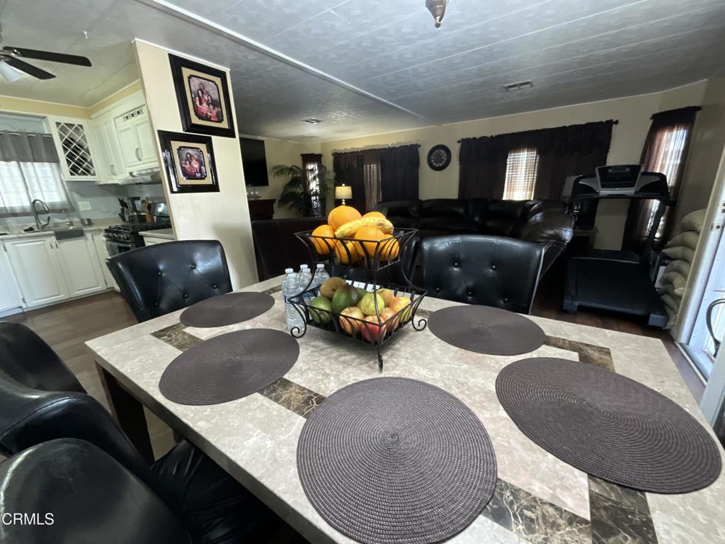 15433 West Telegraph Road, Unit 54 Santa Paula, CA 93060 - Photo 9 of 25 a living room with furniture and wooden floor