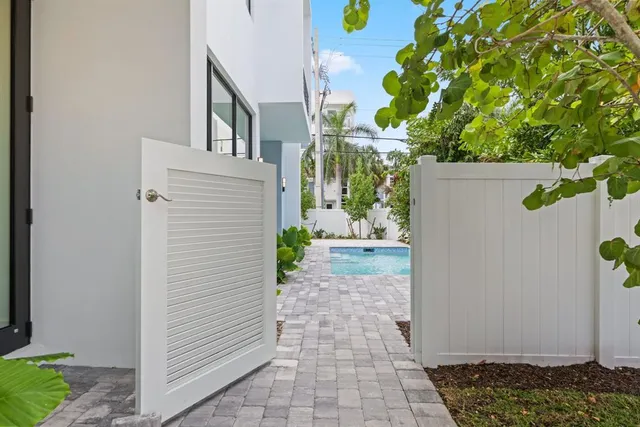 a dining room with furniture a fireplace and a floor to ceiling window
