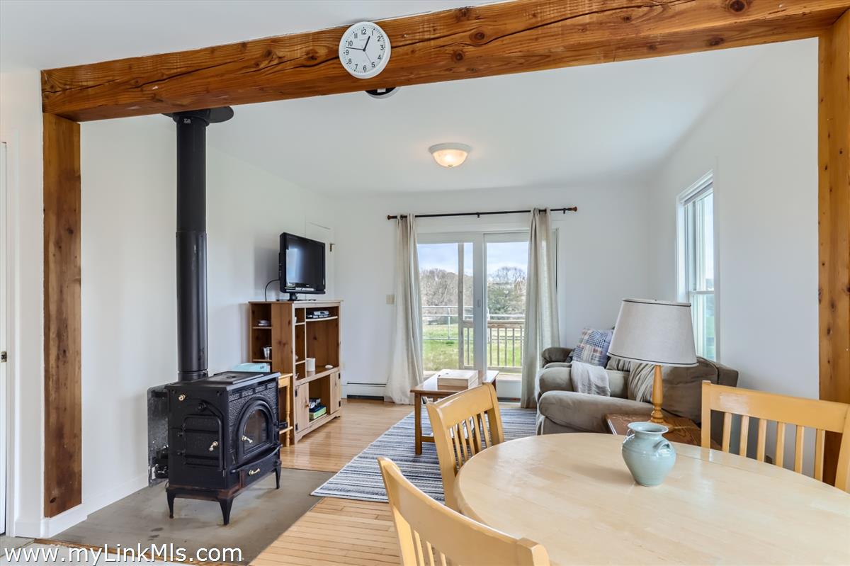 104 Pond View Farm Road West Tisbury, MA 02568 - Photo 45 of 55 a living room with furniture and a flat screen tv