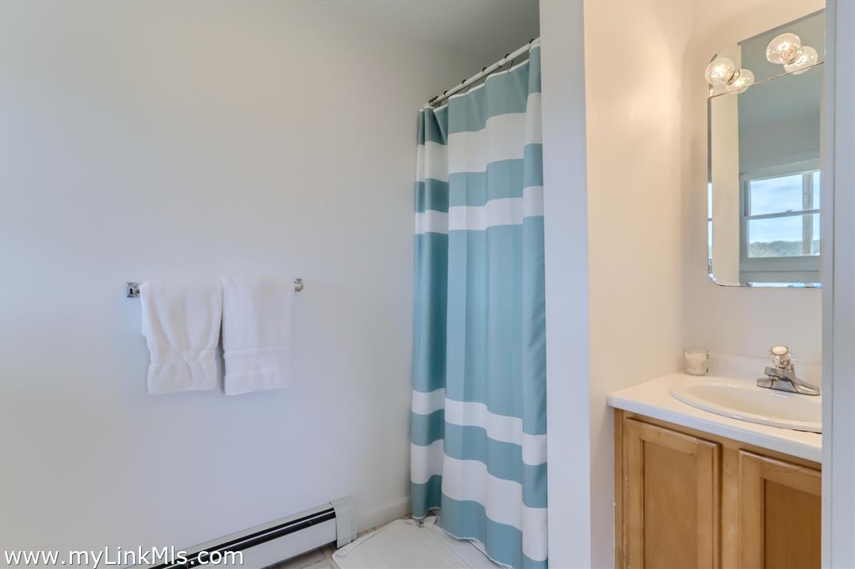 104 Pond View Farm Road West Tisbury, MA 02568 - Photo 48 of 55 a bathroom with a sink and mirror