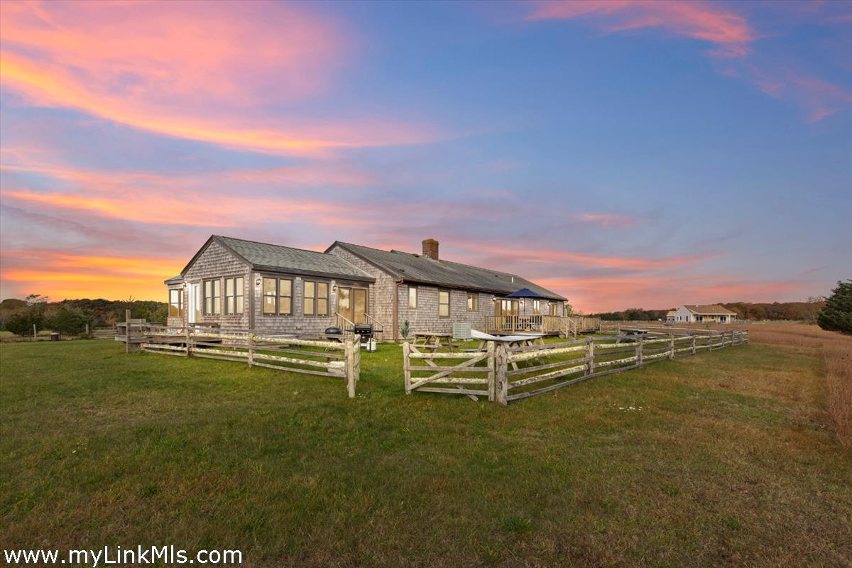 104 Pond View Farm Road West Tisbury, MA 02568 - Photo 6 of 55 a view of a large lake with a big yard