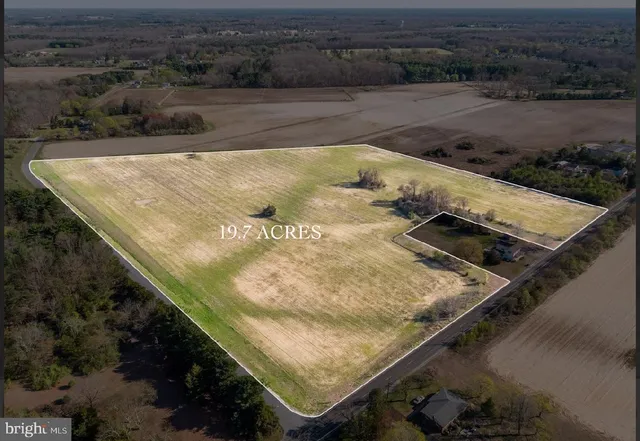 a view of a swimming pool with a yard