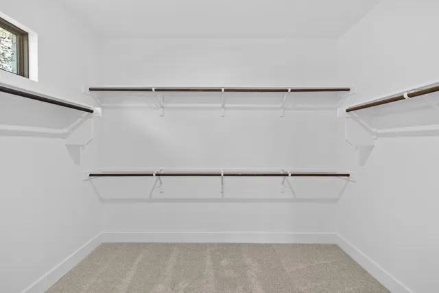 a bathroom with a sink shower and a mirror