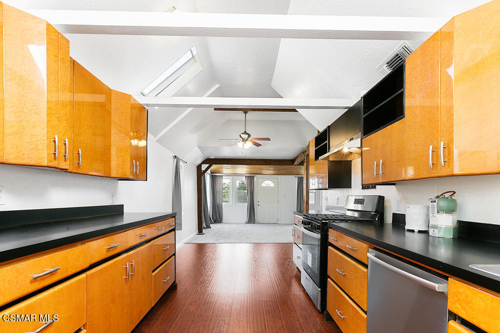 6314 Alta Vista Road Simi Valley, CA 93063 - Photo 12 of 39 a kitchen with stainless steel appliances granite countertop a sink a stove cabinets counter space and a window