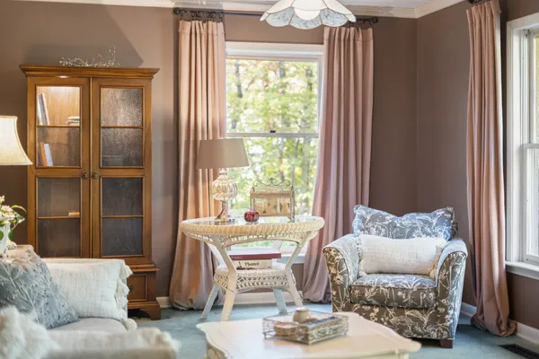 a living room filled with furniture and a table