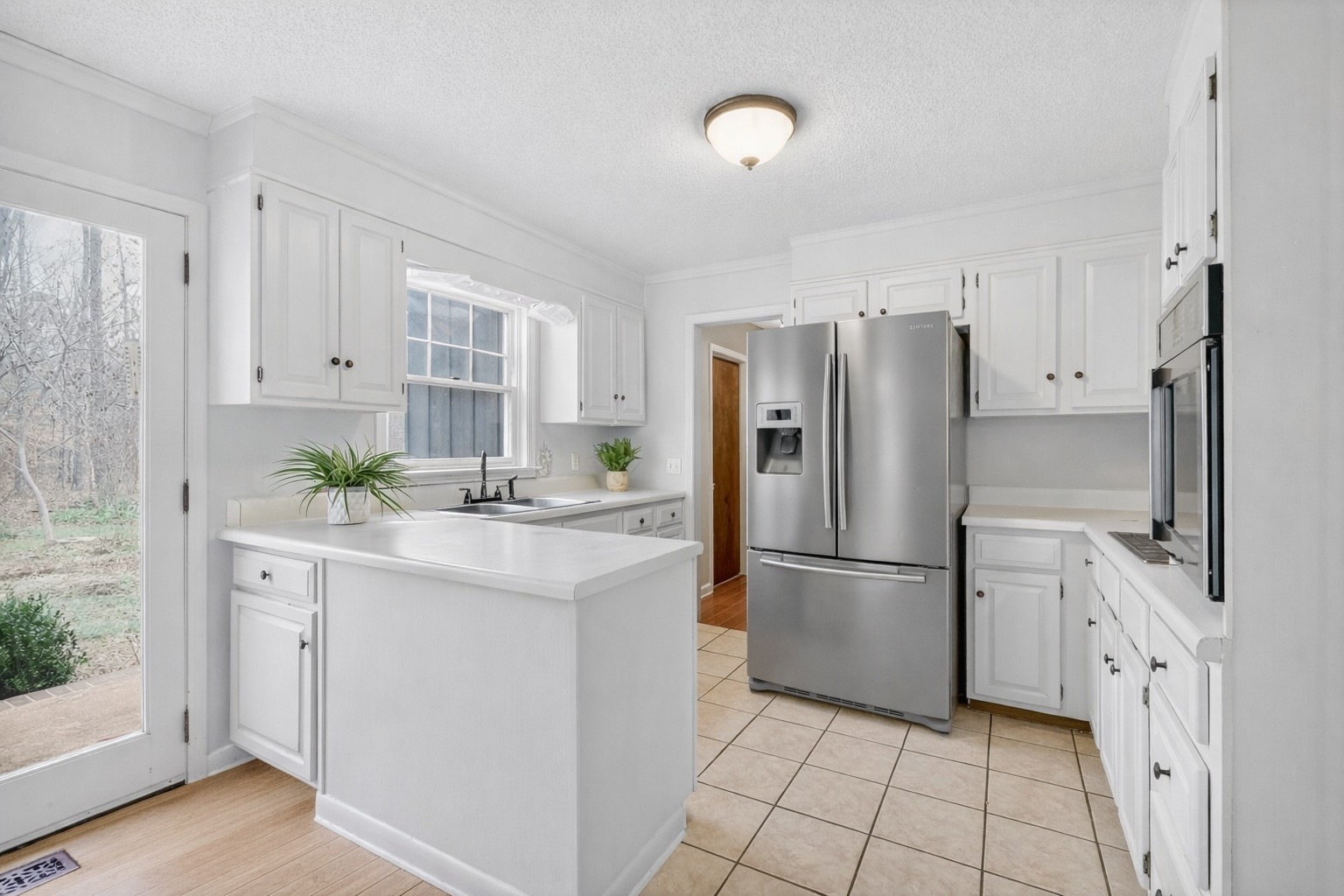 954 Belmont Road Manchester, TN 37355 - Photo 20 of 65 a kitchen with stainless steel appliances a refrigerator sink and cabinets