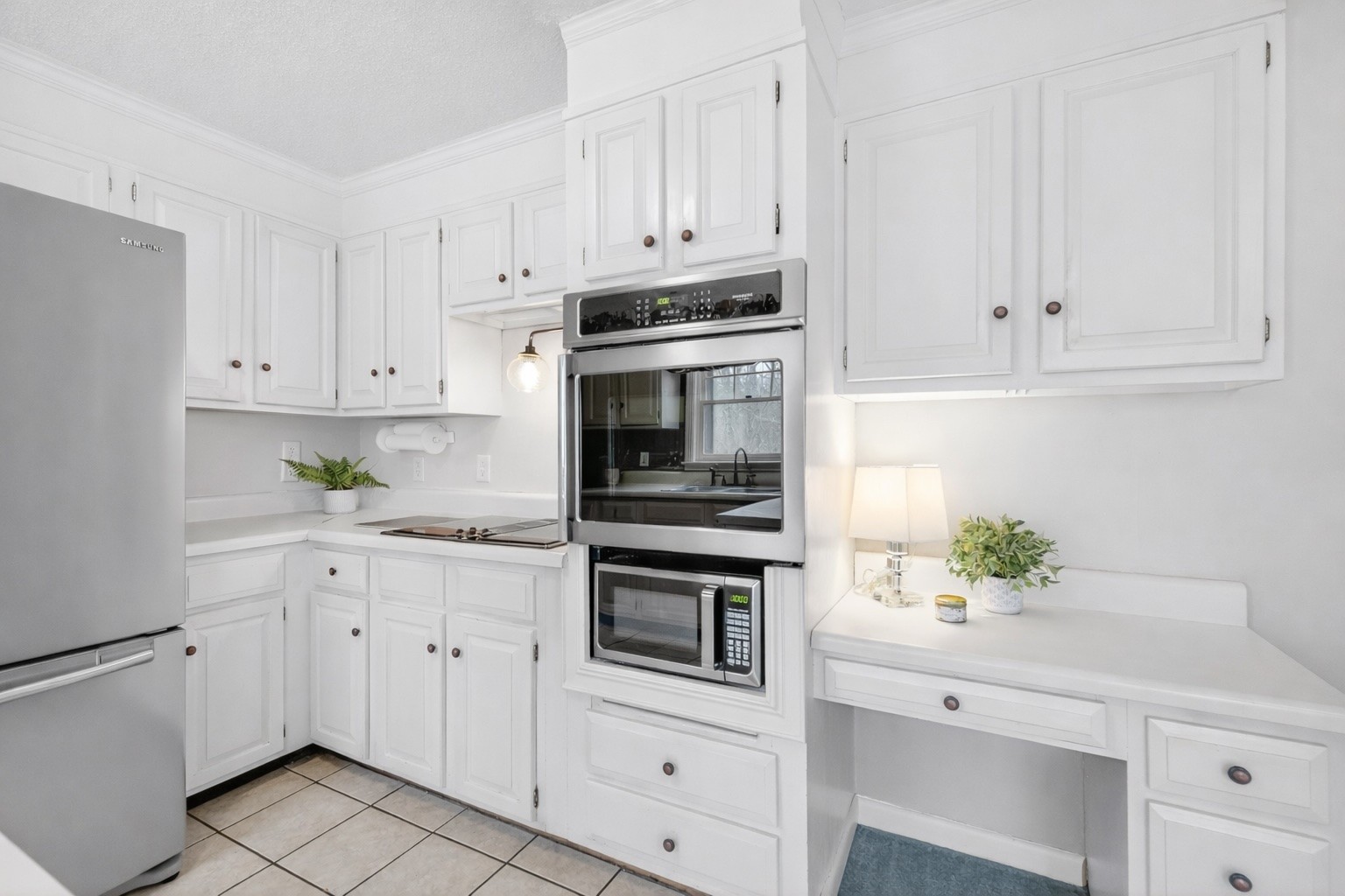 954 Belmont Road Manchester, TN 37355 - Photo 22 of 65 a kitchen with white cabinets and white appliances
