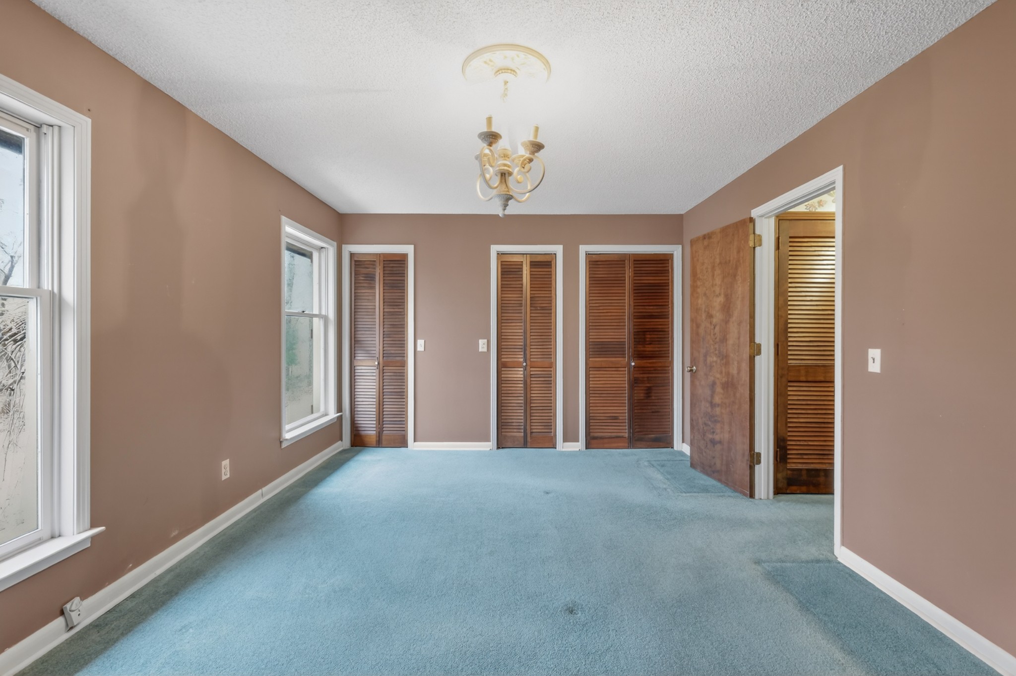 954 Belmont Road Manchester, TN 37355 - Photo 28 of 65 a view of a livingroom with a chandelier fan and windows
