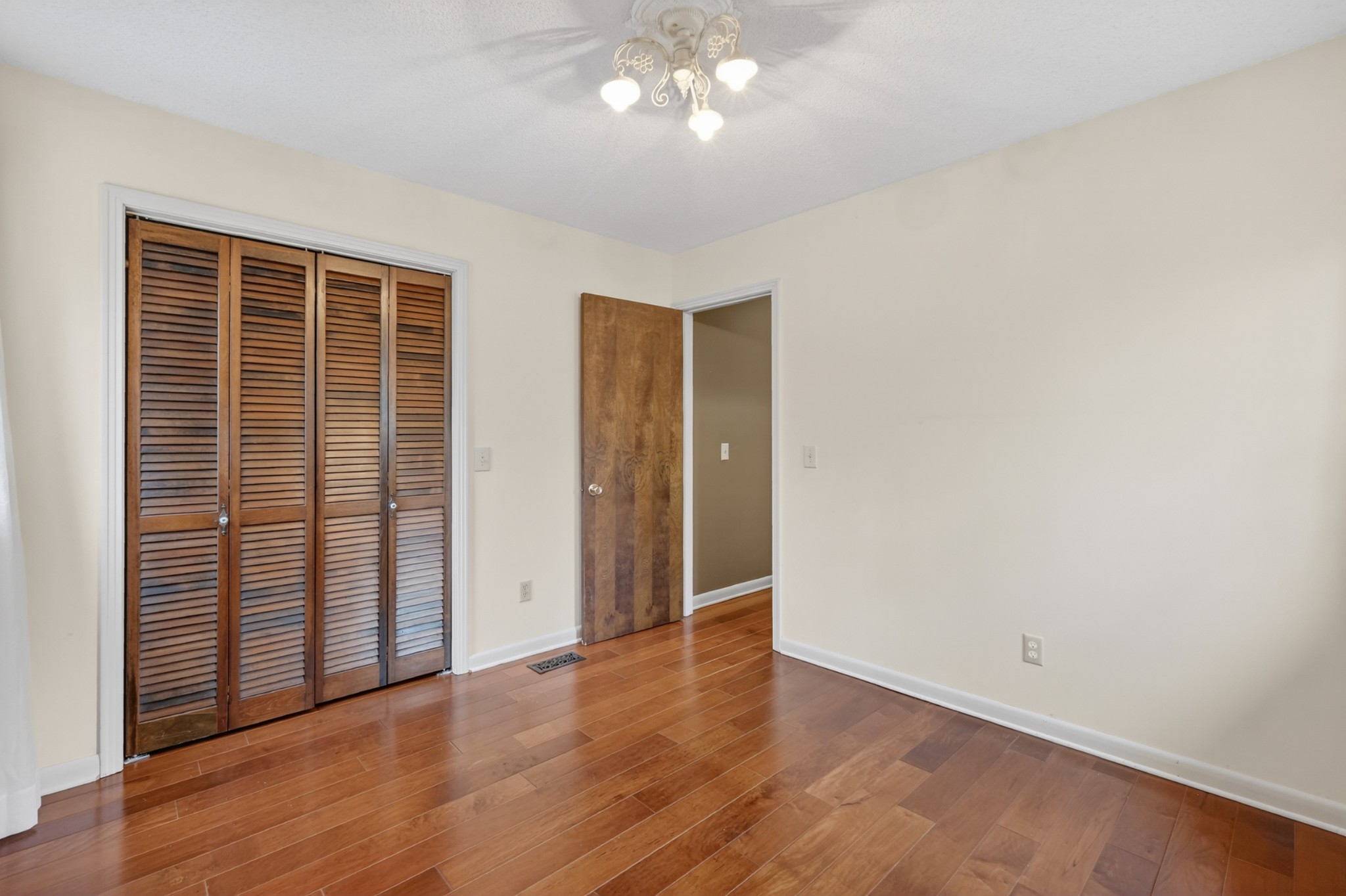 954 Belmont Road Manchester, TN 37355 - Photo 39 of 65 an empty room with wooden floor and windows