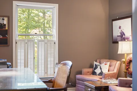 a spacious bedroom with a bed and a dresser