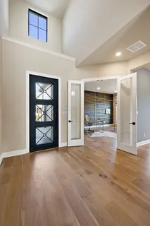 a kitchen with a refrigerator and a sink