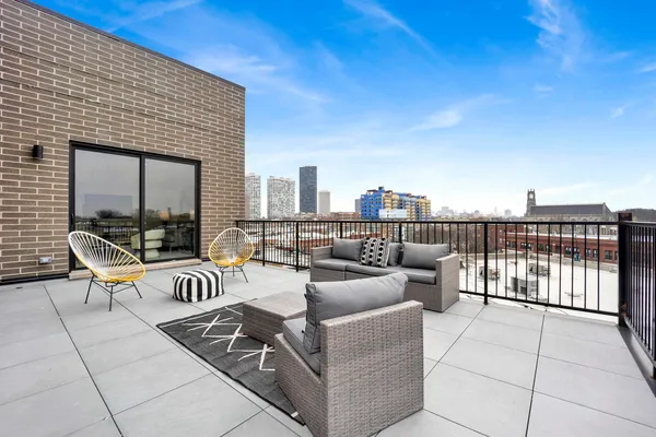 a outdoor living space with furniture and city view