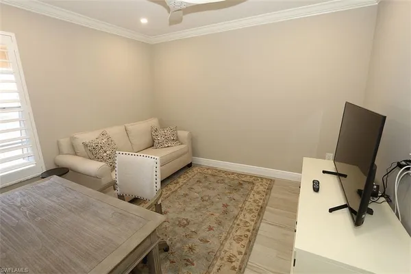 a living room with furniture and a rug