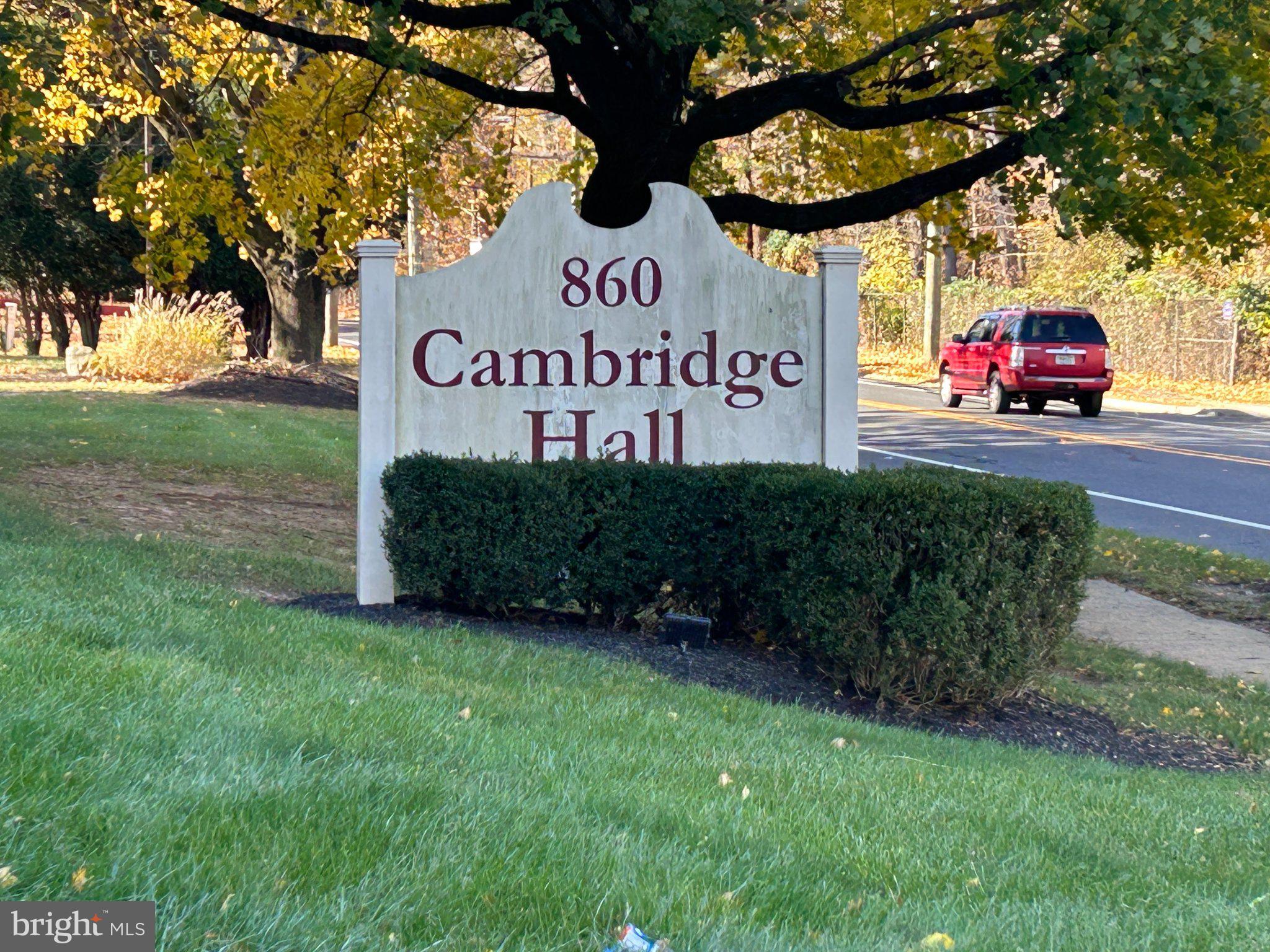 a view of outdoor space with sign board and garden