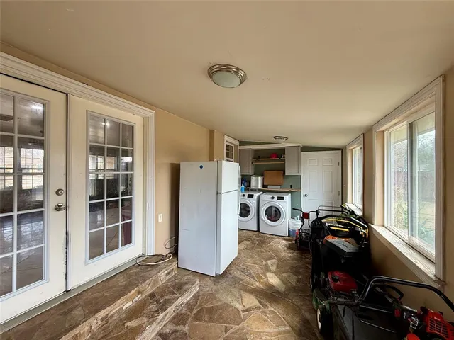 a view of a livingroom with furniture and windows