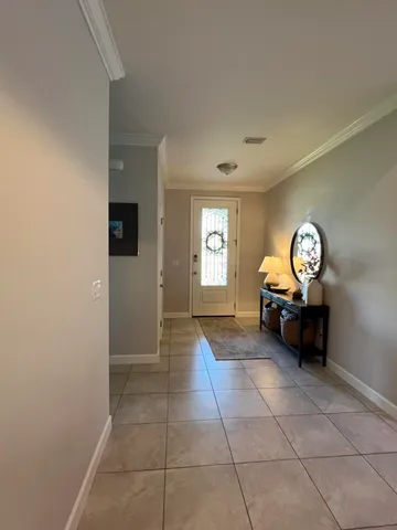 a living room with couches and a flat screen tv